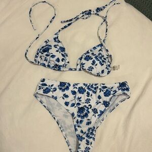 Cute blue and white tie string bikini. Size medium. Worn once, like new.